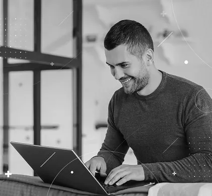 WebAnatics designer reviewing a website layout on a laptop